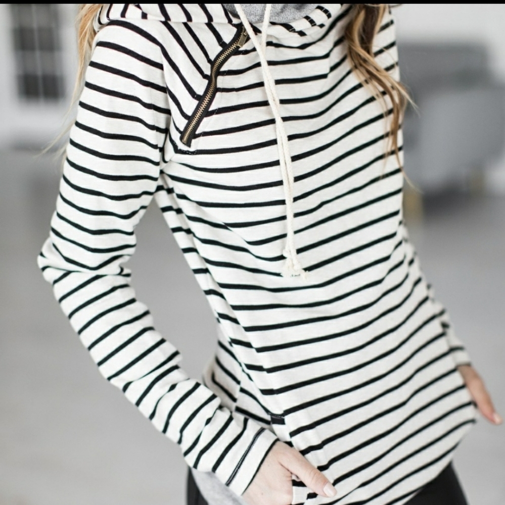 Women's double hooded pullover with thumb holes.